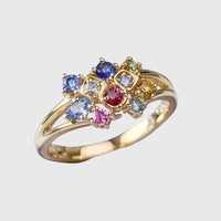 Anillo dorado con cristal de colores