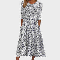 Sara | Vestido midi de flores con bolsillos