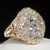 Anillo vintage dorado con diamantes redondos