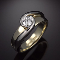 Anillo vintage trenzado dorado y plateado con circonita